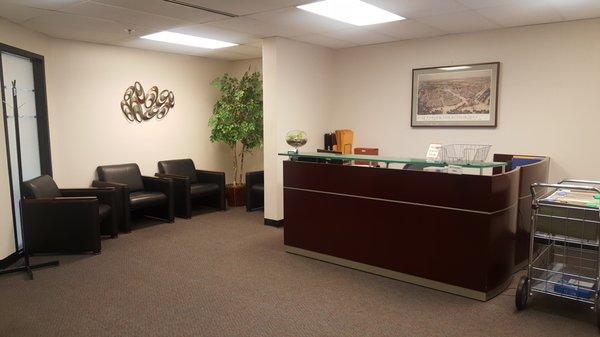 Modern, comfortable waiting area for your guests with restroom and drinking fountain nearby.