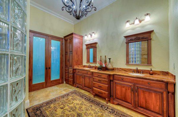 Stunning Natural Wood Cabinets are the Focal Point of This Bathroom