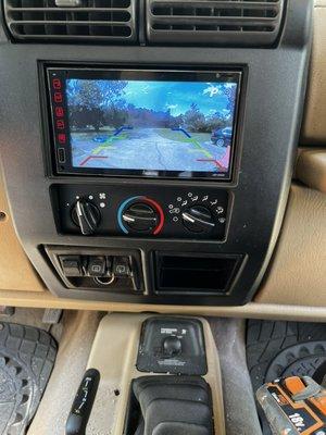 Custom fit dual din stereo upgrade in a Jeep TJ Wrangler