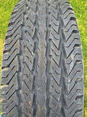 Tread showing newness of tire.