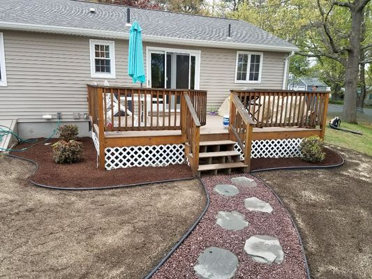 Stone walkway with planting and lawn install