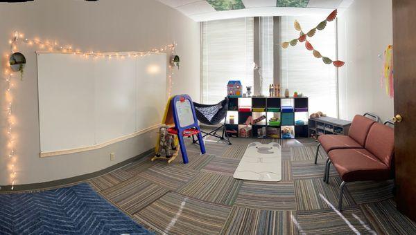 Larger room with alternative seating options ( not pictured, crash pad, balance balls), sensory items, and modified lighting/sound options.