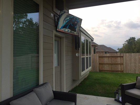 Mounted a 50" TV under a patio with an articulate bracket.  Also installed power for the TV.