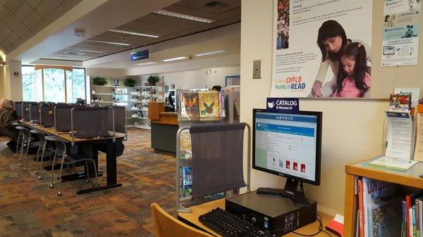 Computers area, holds pickups, and library card services.