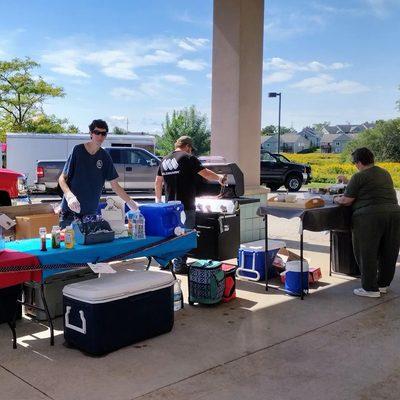 Andrew, Derek & Christina setting up for the donation based cookout