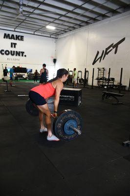 A solo athlete demonstrating raw power and determination during a class.