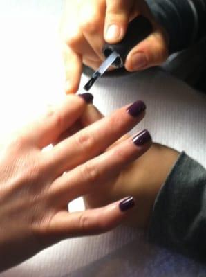 Felicia is doing Shellac on one of her clients