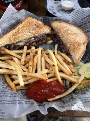 Patty melt with shoestring fries.