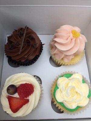 Triple chocolate, strawberry lemonade, triple berry, and vanilla cupcakes