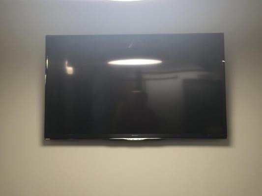 60" Sharp mounted in the waiting area of Walnut Capital.