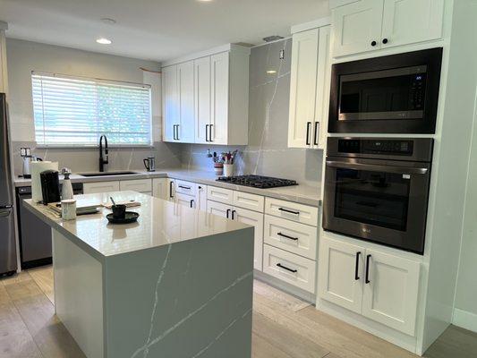 Quartz countertops waterfall and backsplash