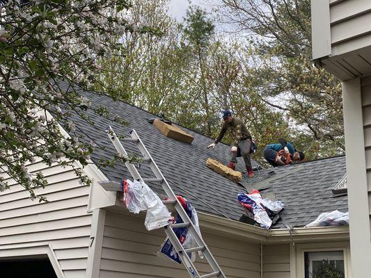 The crew working on putting a new roof on our house.