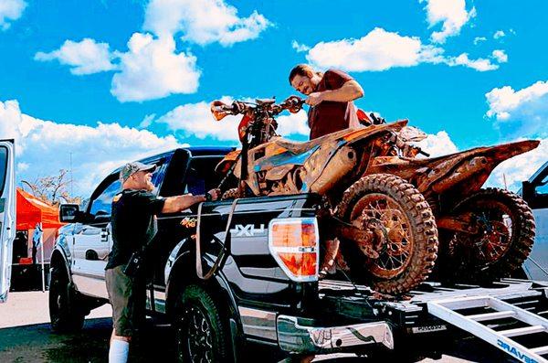 Beau loading up dirt bikes after a great day of riding.