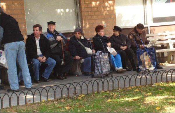 Russians from the local community wait for their prescriptions