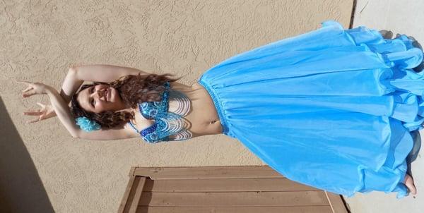 Customized costume as well as belly dancing routine for an outdoor corporate event.