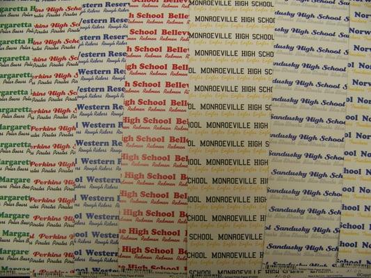 We offer scrapbook paper for many of the area schools.