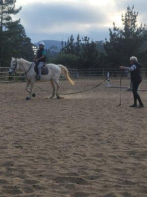 Student learning more about balance and body position while on a lunge line with trainor Dru Nagle