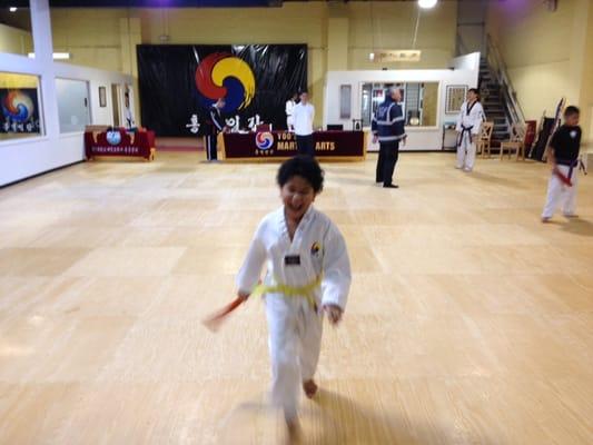 The joy of getting his orange belt!