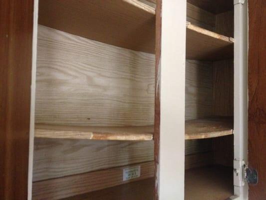 Warped kitchen cabinet shelves at move in