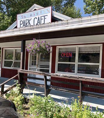 Park Cafe: peeling paint, splintered railings and overgrown with weeds