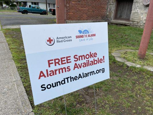 A sign promoting the Home Fire safety Campaign of the American Red Cross.