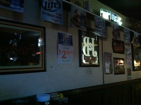 Photo of Miller Lite with Whiskers Pub on sign.