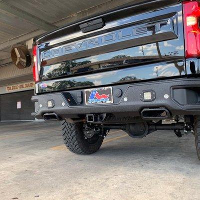 Factory Chevrolet rear bumper bedlined with Rigid reverse lights installed