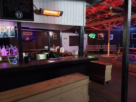 Back Bar with Heaters, Tvs. cornhole, and music