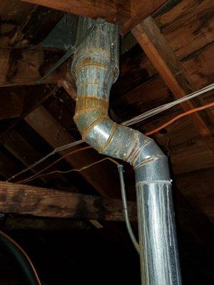 Single wall furnace flue in attic it rusting out. Needs double wall pipe in attic.