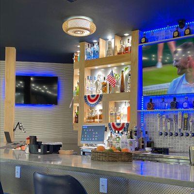 Outlets and usb chargers under the bar.