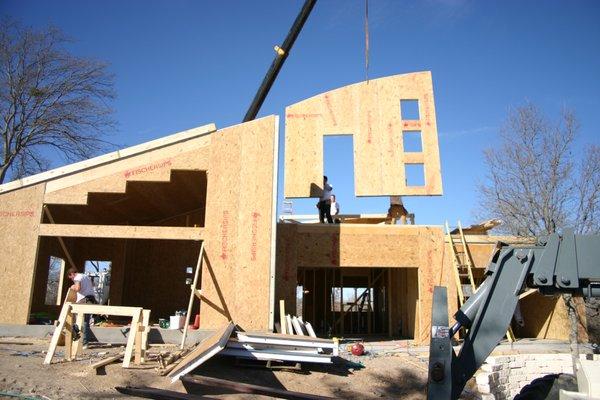 Precut wall panels being set