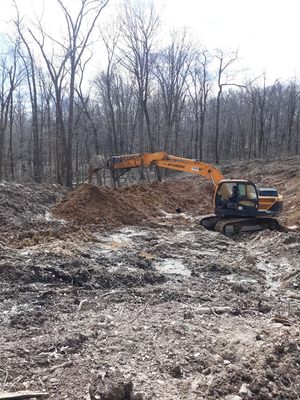 Working on digging a pond