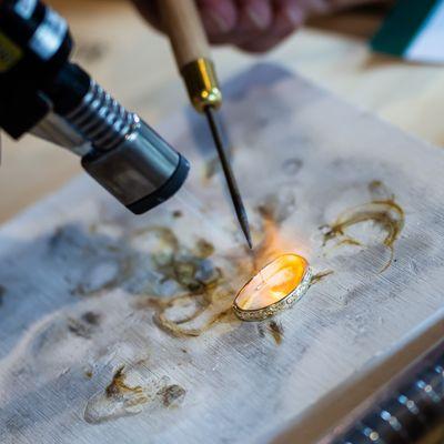 Soldering during a Sip & Stacker Ring Making Class