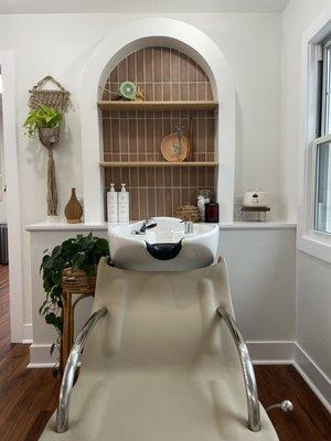 Beautiful, cozy shampoo bowl area featuring all natural, non toxic products.