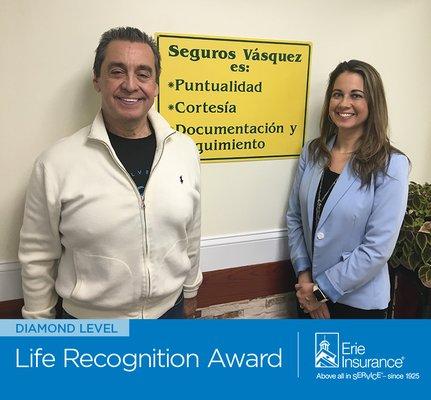 Seguros Vasquez located in Wheaton, Maryland accepts the Blue Diamond  Recognition Award from Erie Insurance. (301) 962-3333.