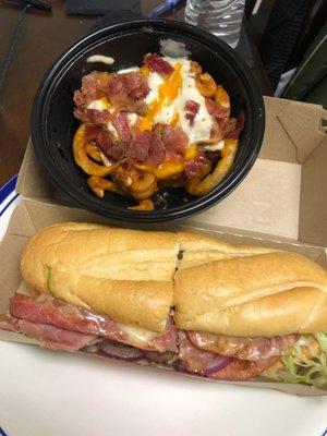 Italian sub and curly fries.