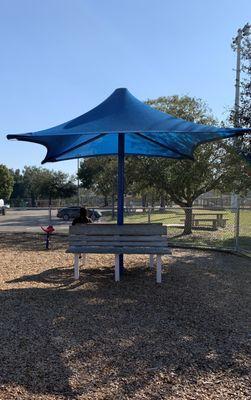 Another area for parents to watch playground covered by shade inside area.