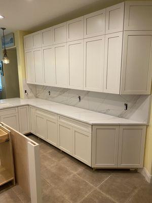 Veinmatch Quartz countertops with full height backsplash