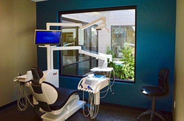 Treatment room looking into beautiful atrium.