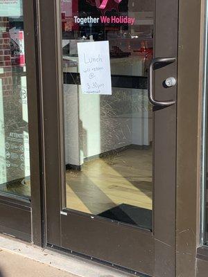 Store with sign saying employee is at lunch