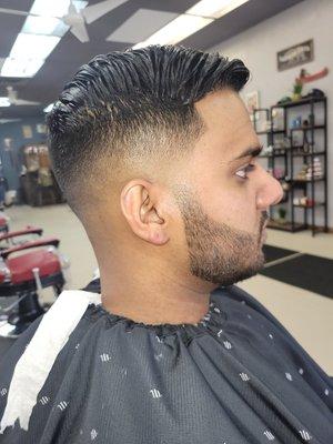 Medium high skin fade, straight razor beard trim