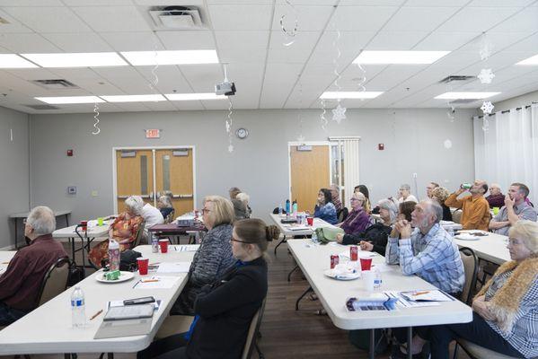 Seniors learning about how a reverse mortgage can help them in their retirement