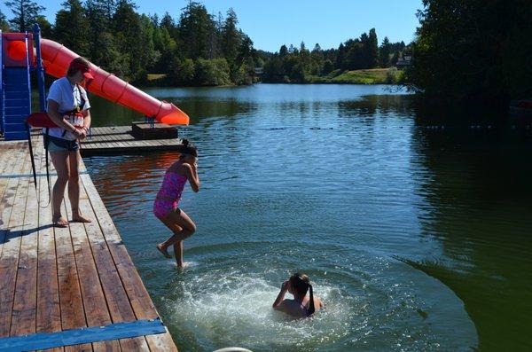 Campers jump into the lagoon.