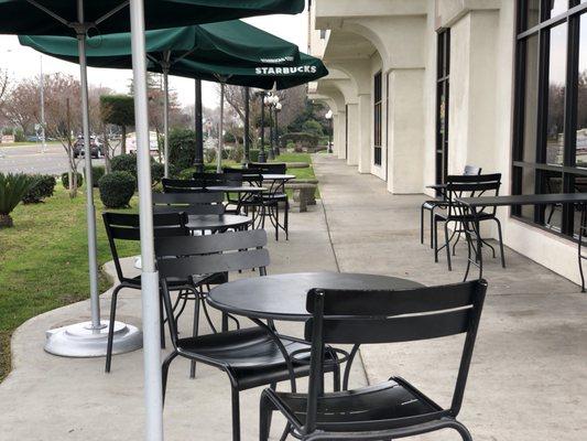 Outdoor seating located in the front entrance on Olive Ave.