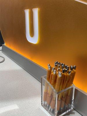 Beautiful UTFCU pod divider - conduct business in an inviting environment with just the right amount of privacy. Take a pen while you're in!