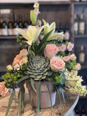 Flower arrangement with roses, lilies and succulent