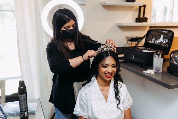 Ayesha pinning my crown in.    Photo by: Trevor and Elisebeth (@trevorandelisebeth)