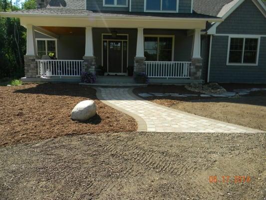 We created a very inviting entrance using three types of pavers to create the walkway and landing, using colors to compliment...