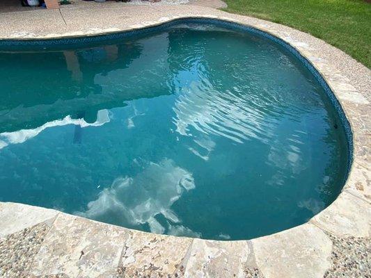 Pool after first week of cleaning.  Many of the patches of white are dirt not clouds.