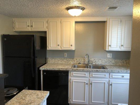 3 bedrooms are getting a facelift!  Love this kitchen with black energy star appliances